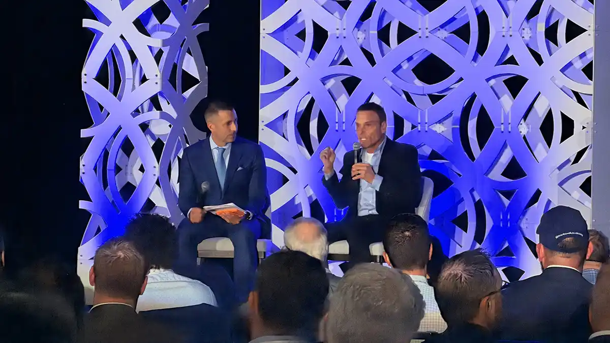 Fireside chat on stage at a Family Office Club event